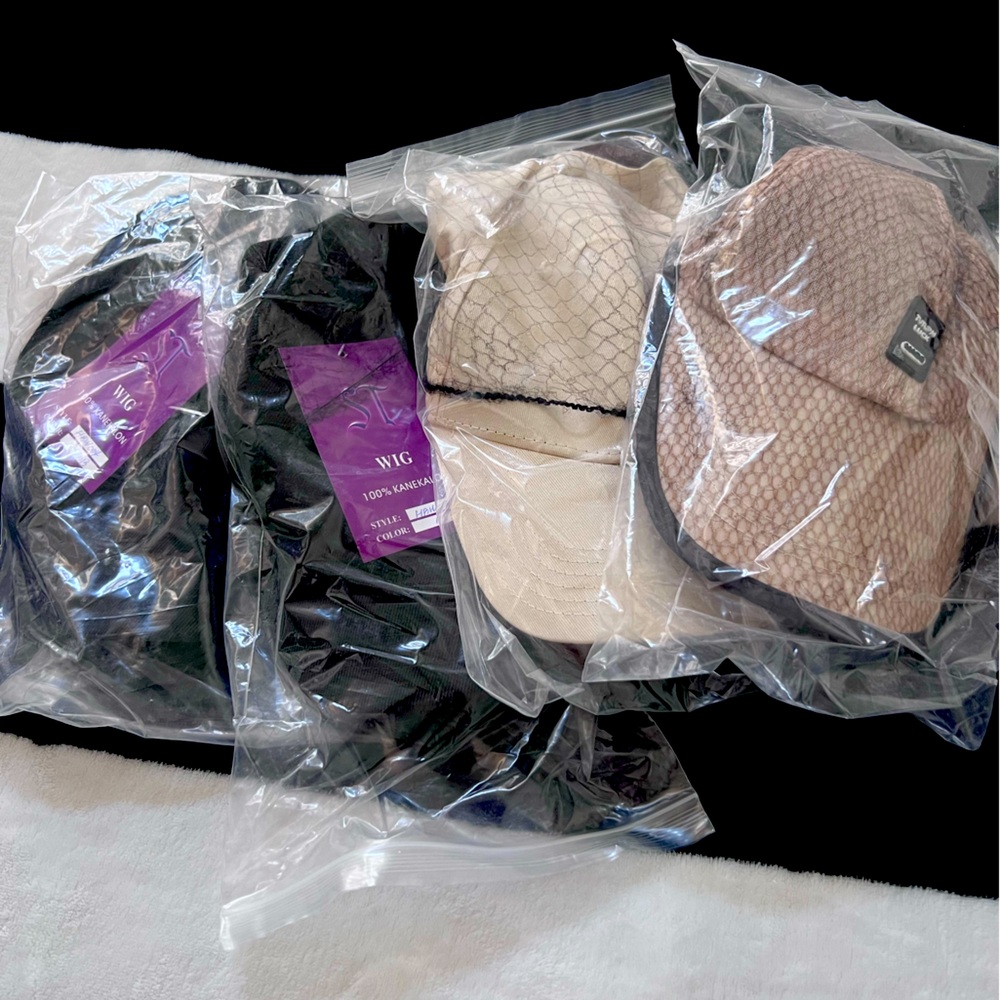 Baseball cap wigs in various colors still available. only one left in jet black.